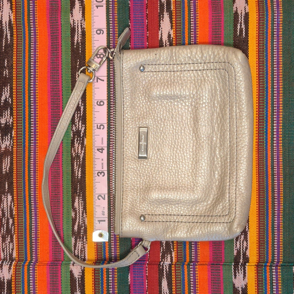 Cole Haan leather bronze gold wristlet pink fuschia lining with card holder used